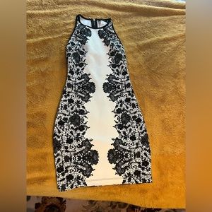 Cute white dress with black lace print. Size 1/2 worn once